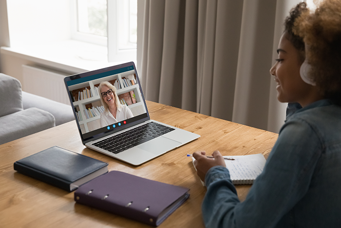 Student on laptop for telehealth call